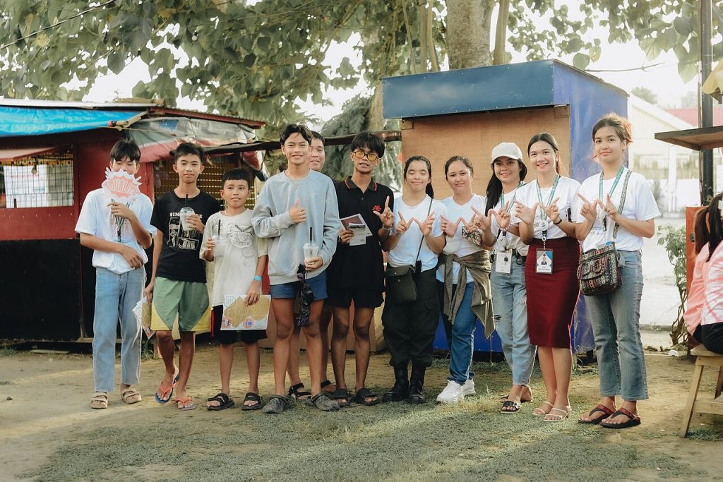 Volunteers and young people at a community event